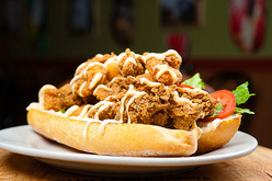 Fried Shrimp and Oyster Po-boy on french bread, dressed